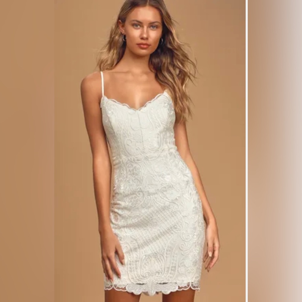 LuLu’s Dress 

Beautiful White Lace Dress Fully Lined with 
Spaghetti Straps